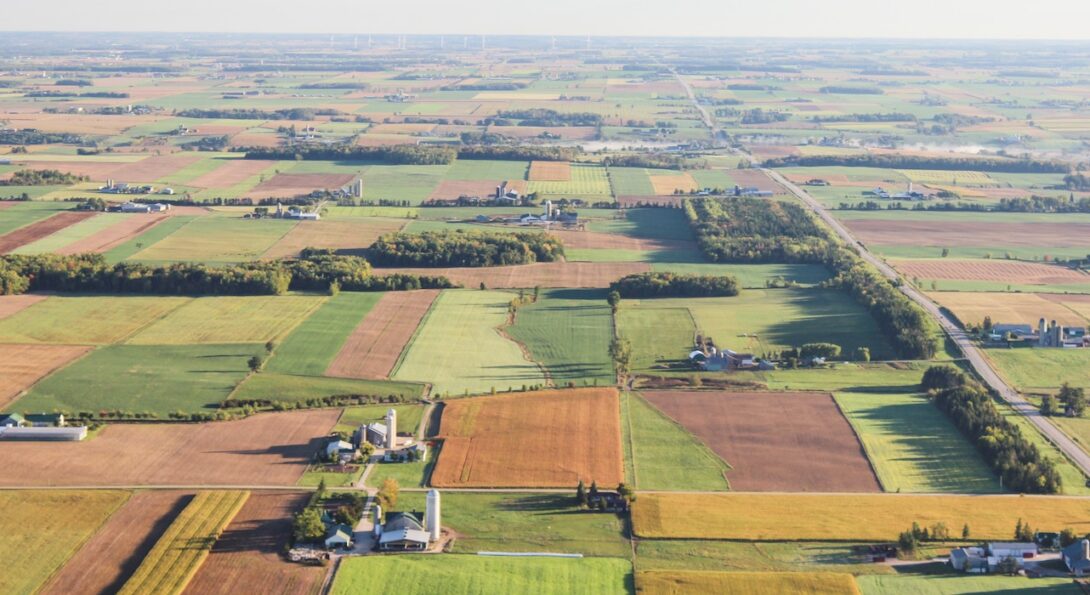 An aerial few of agricultural land extending past the horizon underscores how big a task monitoring Illinois farm safety will be.