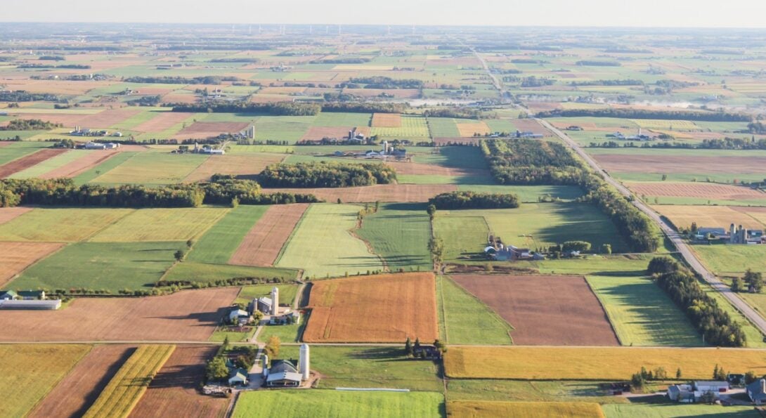 An aerial few of agricultural land extending past the horizon underscores how big a task monitoring Illinois farm safety will be.