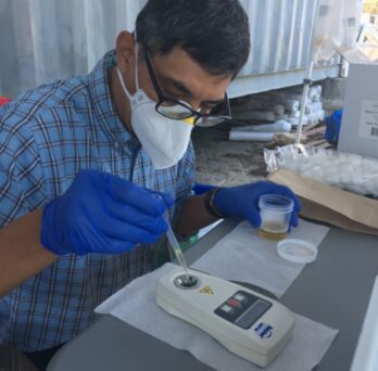 A member of the research team processes urine samples from farm workers in Florida to assess levels of dehydration. 